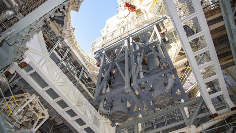 Stennis teams lifting and installing large diffusers onto the B-2 side of the Thad Cochran Test Stand.