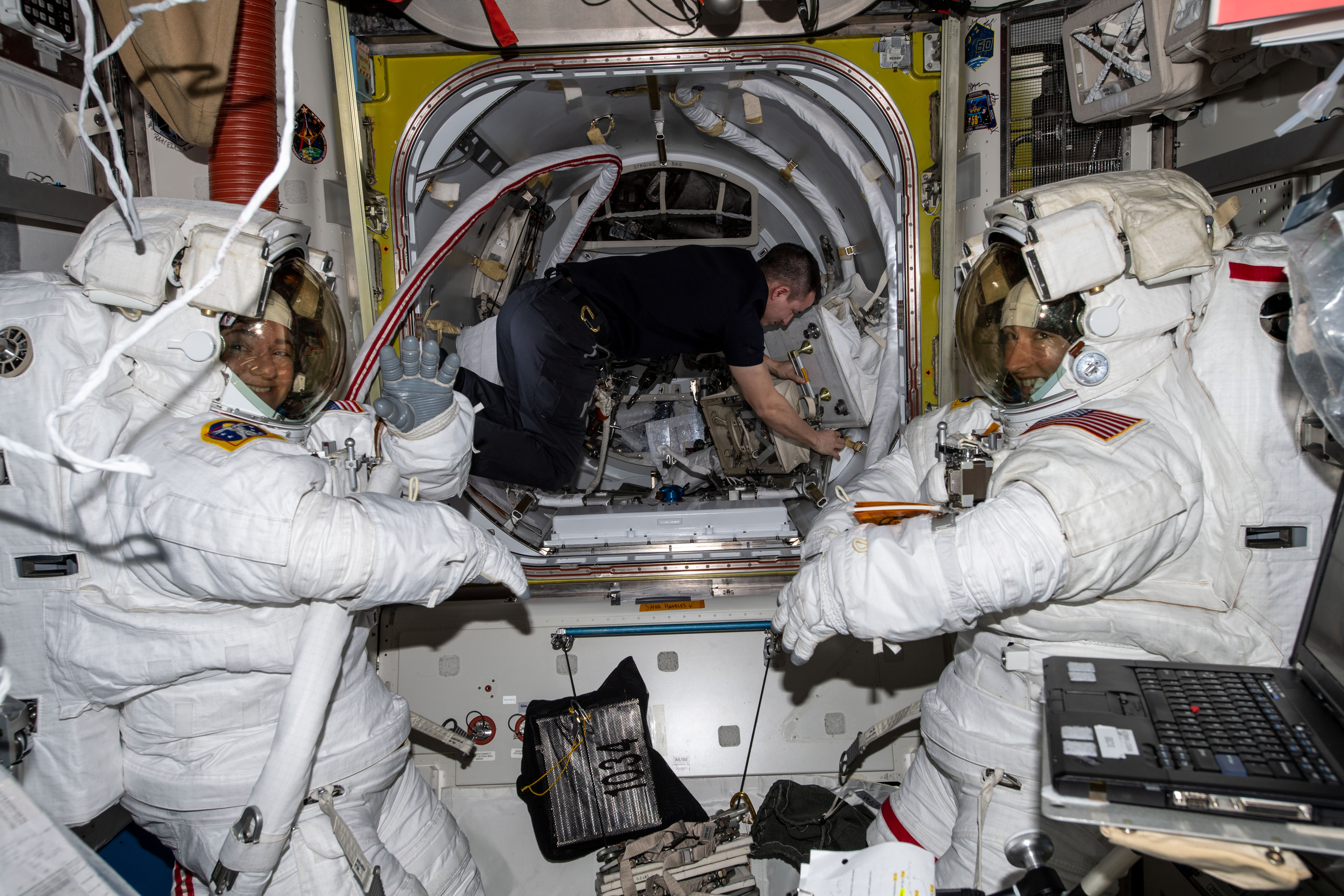NASA astronauts Jessica U. Meir, left, and Koch, assisted by their Expedition 61 crewmates, prepare for the first all-woman spacewalk