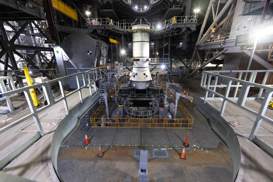 Engineers and technicians with the Exploration Ground Systems Program stack the first Moon rocket segment â the left aft assembly for the Artemis II SLS (Space Launch System) solid rocket booster onto mobile launcher 1 inside the Vehicle Assembly Building at NASAâs Kennedy Space Center on Wednesday, Nov. 20, 2024.