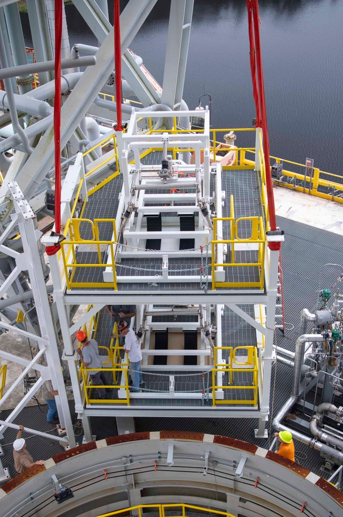 A pair of umbilical support structures needed for future testing of NASA’s exploration upper stage (EUS) are shown suspended in air