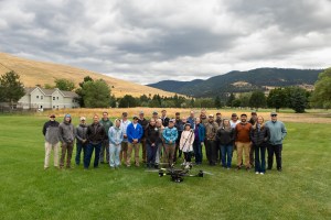 Teams from NASA FireSense, NASA Langley, NASA Ames, MITRE, Esri, Salish Kootenai College, and the University of Idaho gather for a group photo around the NASA Alta X quadcopter during the 2024 FireSense uncrewed aerial system (UAS) technology demonstration in Missoula, Montana.