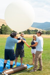 (From left) Travis Christopher, Danny Johnson, Meredith Heckler, and Steven Stratham prepare a weather balloon for launch. This team from Salish Kootenai College is one of two teams that supported the FireSense UAS Technology Demonstration in Missoula, Montana.