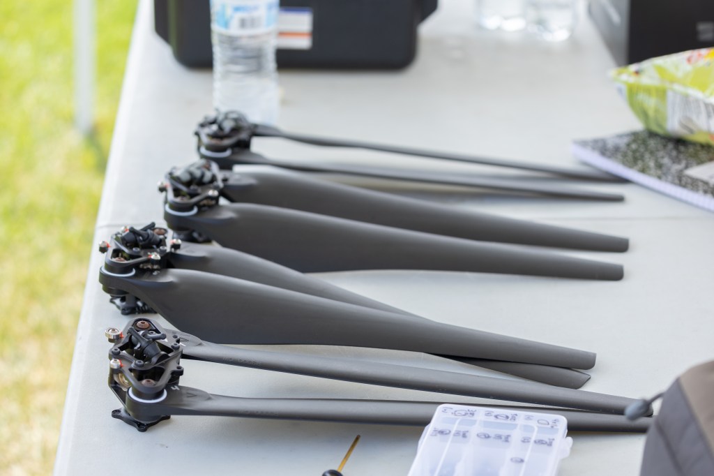 Rotor blades for the NASA Alta X quadcopter sit in the control tent, ready for assembly.