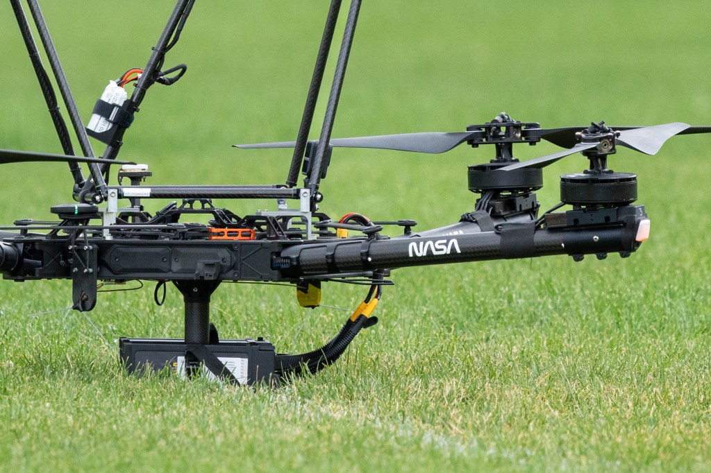 The NASA Alta X quadcopter sits at the ready between launches as the drone crew waits for clearance to take off. This uncrewed aerial system (UAS) carried two sensors, a radiosonde and an anemometer, to measure wind speed and direction during the 2024 FireSense UAS technology demonstration.