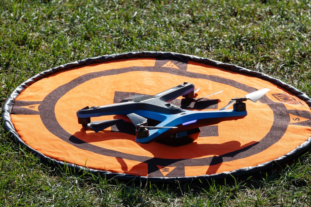The Skydio-2 drone sits in a field just before takeoff during the FireSense uncrewed aerial system (UAS) technology demonstration in Missoula, Montana. The Skydio-2 was flown to capture images and videos of the NASA Alta X quadcopter in flight.