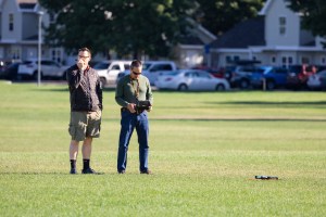 Tim Wallace radios in to request clearance for takeoff while Todd Ferrante prepares the Skydio-2 drone for launch during the last day of the FireSense uncrewed aerial system (UAS) technology demonstration in Missoula, Montana.