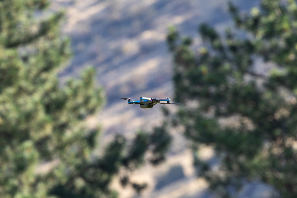 The Skydio-2 drone hovers in the air during the FireSense uncrewed aerial system (UAS) technology demonstration in Missoula, Montana. The Skydio-2 was flown to capture images and videos of the NASA Alta X quadcopter in flight.