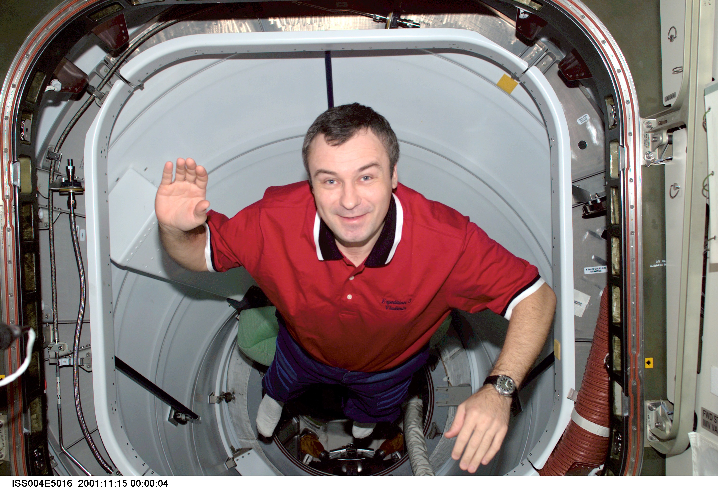 ISS004-E-5016 (December 2001) --- Cosmonaut Vladimir N. Dezhurov, Expedition Three flight engineer, floats through the Pressurized Mating Adapter 2...