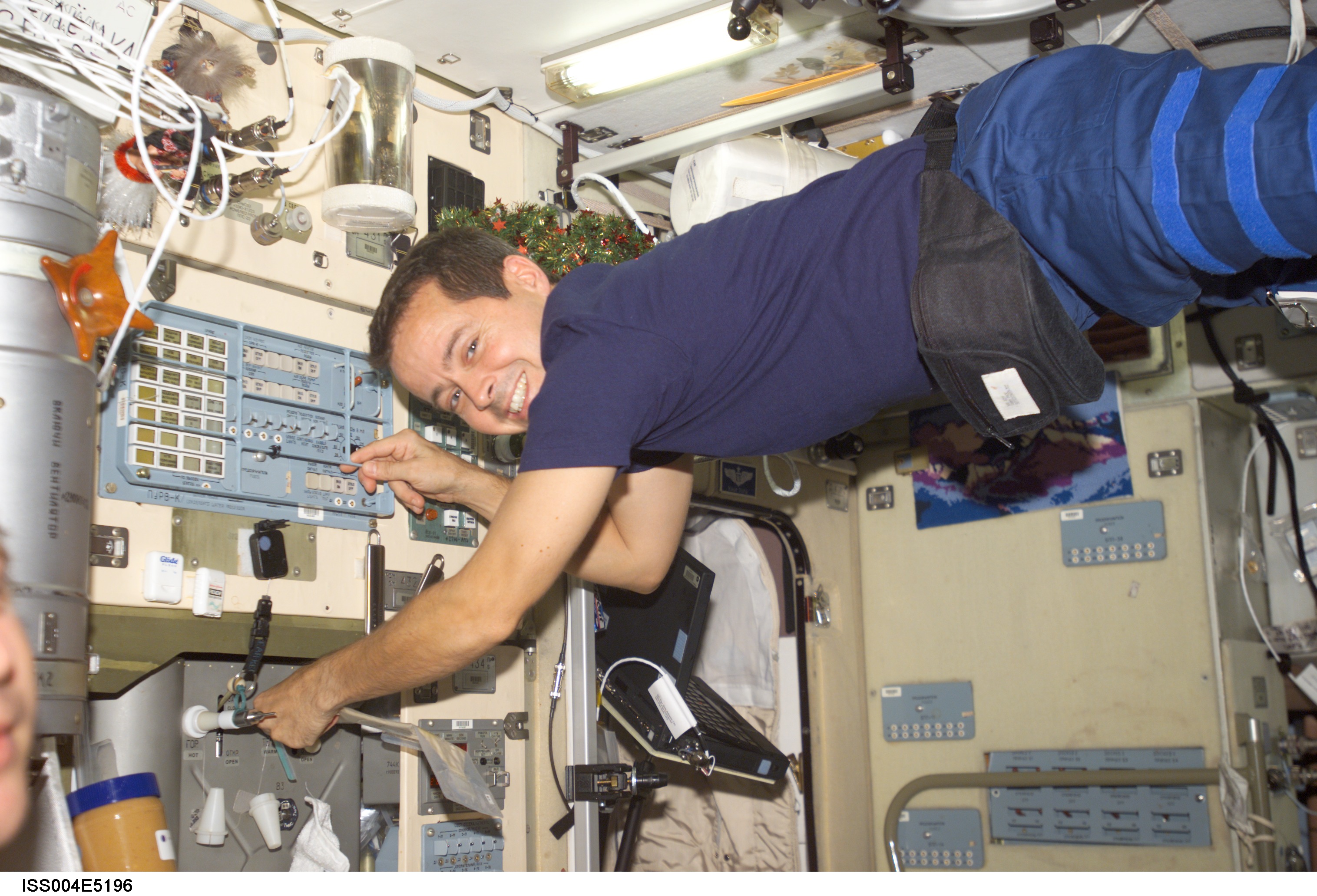 ISS004-E-5196 (December 2001) --- Astronaut Daniel W. Bursch, Expedition Four flight engineer, works in the Zvezda Service Module on the International Space Station (ISS). The image was taken with a digital still camera.