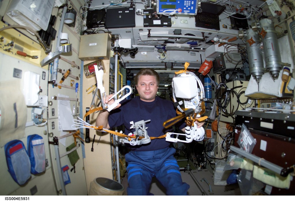 ISS004-E-5931 (January 2002) --- Cosmonaut Yury I. Onufrienko, Expedition Four mission commander representing Rosaviakosmos, works with the Amateur Radio (HAM) WA3 Antenna Assembly in the Zvezda Service Module on the International Space Station (ISS). The image was taken with a digital still camera.