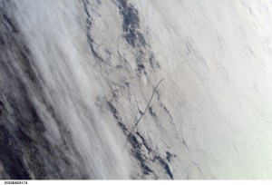 ISS004-E-8174 (1 March 2002) --- This image of Columbia's STS-109 launch plume was taken by the Expedition Four crew using a digital still camera on board the International Space Station. The space station crew shot this photograph as the station flew high over the Atlantic Ocean moments before Columbia's liftoff. The shuttle's plume is visible in the right side of this image, and the plume's shadow is reflected off the clouds to the left.