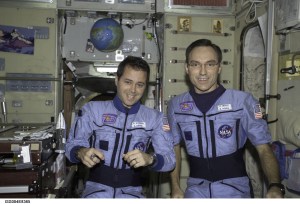 ISS004-E-8365 (3 March 2002) --- Astronauts Daniel W. Bursch and Carl E. Walz, both Expedition Four flight engineers, are photographed in the Zvezda Service Module on the International Space Station (ISS). The image was taken with a digital still camera.