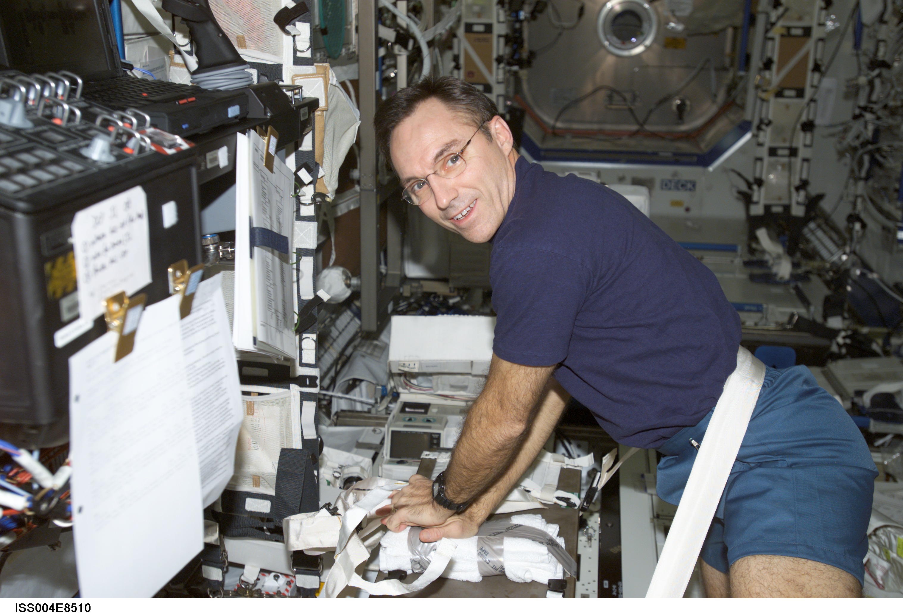 ISS004-E-8510 (11 March 2002) --- Astronaut Carl E. Walz, Expedition Four flight engineer, performs cardio-pulmonary resuscitation (CPR) on a jerry-rigged “human chest” dummy in the Destiny laboratory on the International Space Station (ISS). The image was taken with a digital still camera.