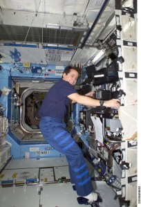 ISS004-E-8652 (14 March 2002) --- Astronaut Daniel W. Bursch, Expedition Four flight engineer, works the controls of the Canadarm2, or Space Station Remote Manipulator System (SSRMS) in the Destiny laboratory on the International Space Station (ISS). This image was taken with a digital still camera.
