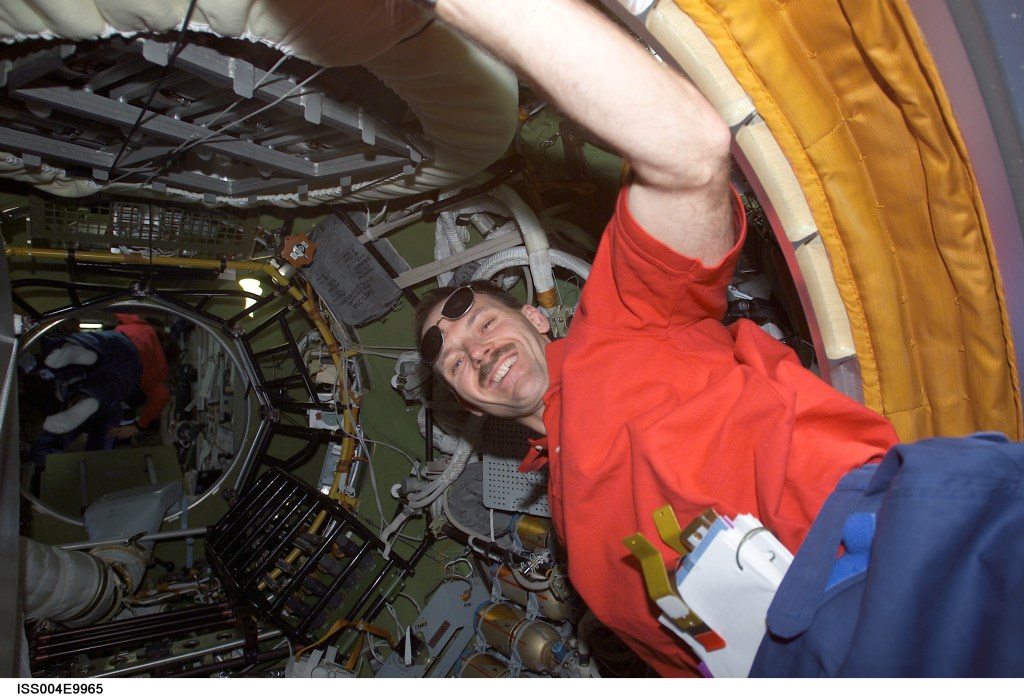 ISS004-E-9965 (10 April 2002) --- Astronaut Steven L. Smith, STS-110 mission specialist, enters the Zvezda Service Module’s transfer compartment on the International Space Station (ISS).