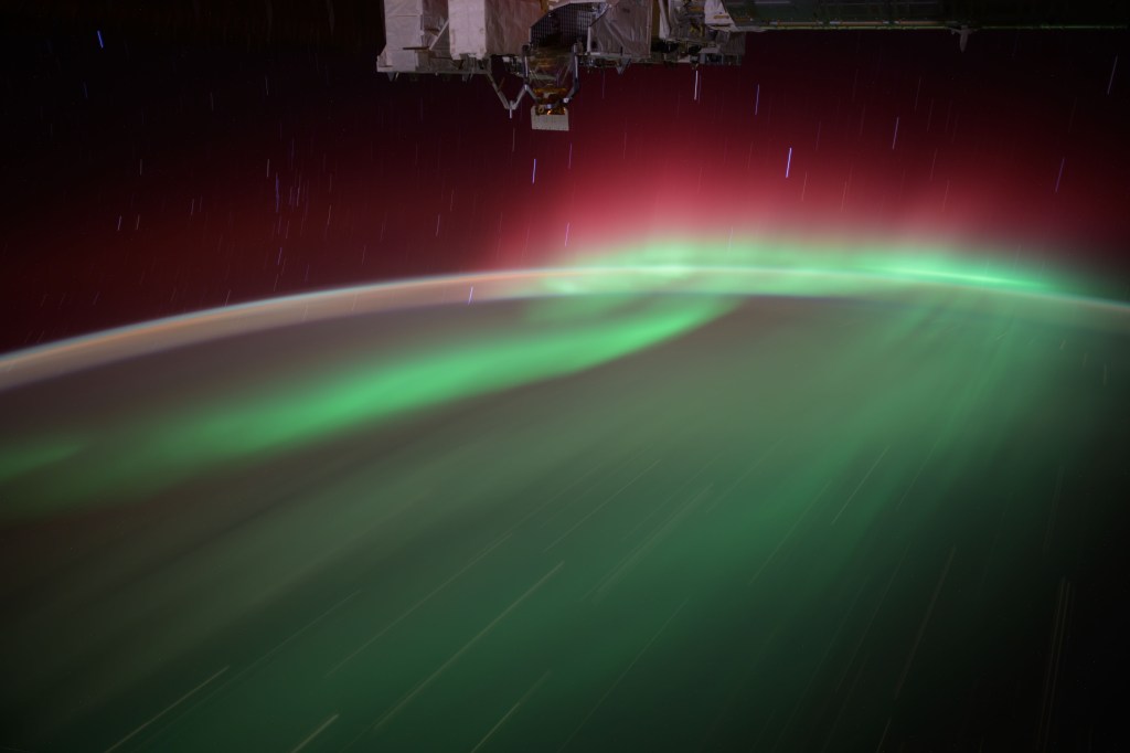 iss072e147641 (Nov. 9, 2024) -- A green and red aurora streaks through Earth's atmosphere as the International Space Station orbited 258 miles above Winnipeg.