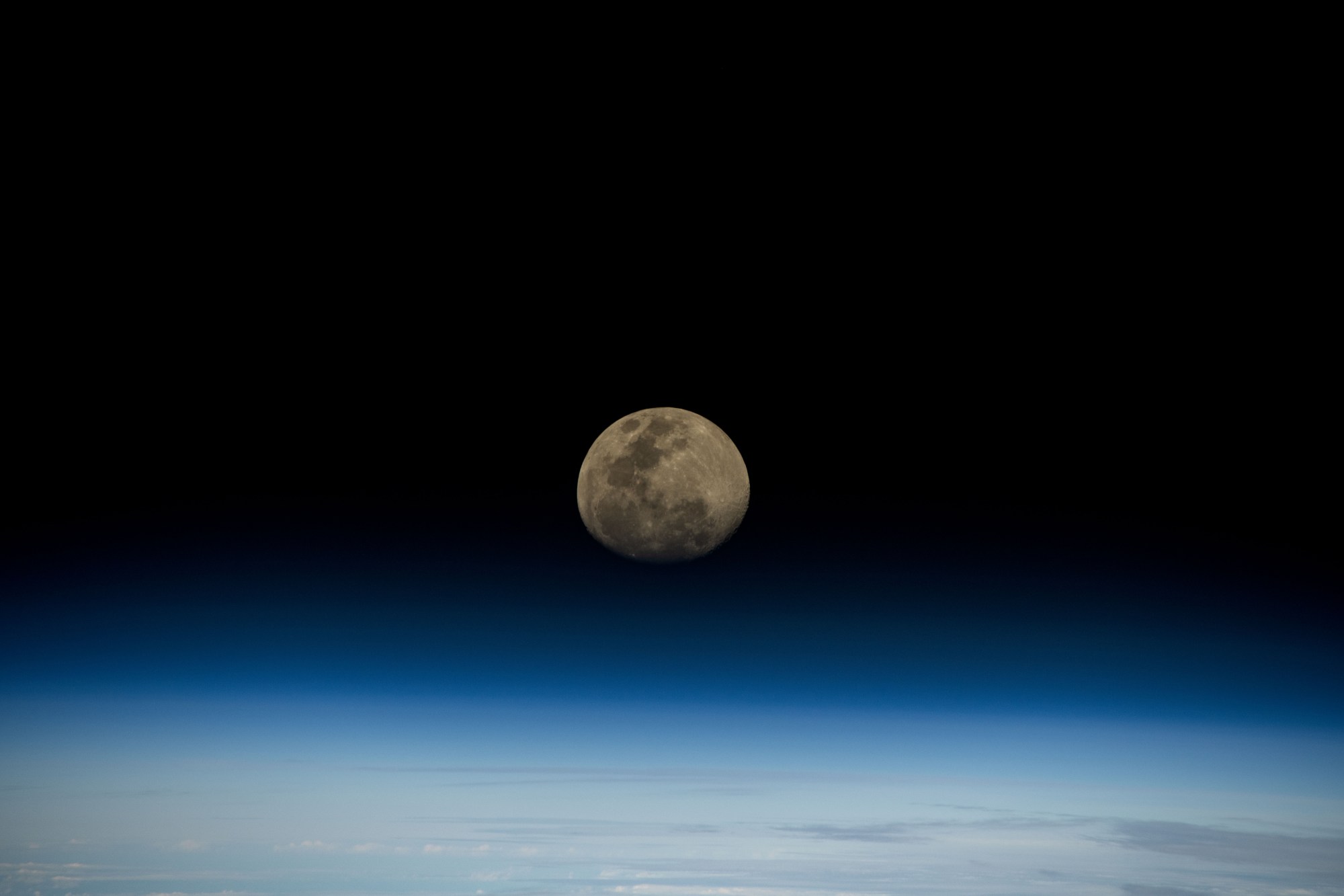 iss072e186870 (Nov. 13, 2024) -- A waxing gibbous moon rises over the blue glow of Earth's horizon as the International Space Station orbited 264 miles above the Indian Ocean.