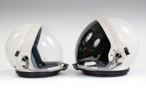 Two sizes of the OCSS suit helmet sit side by side. For future Artemis missions, teams developed a standard sized helmet as well as a smaller size to help with crew protection for narrower shoulder crew members. Credit: NASA/Bill Stafford