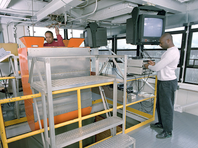 Technicians prepare for a drop on the eighth floor of the tower