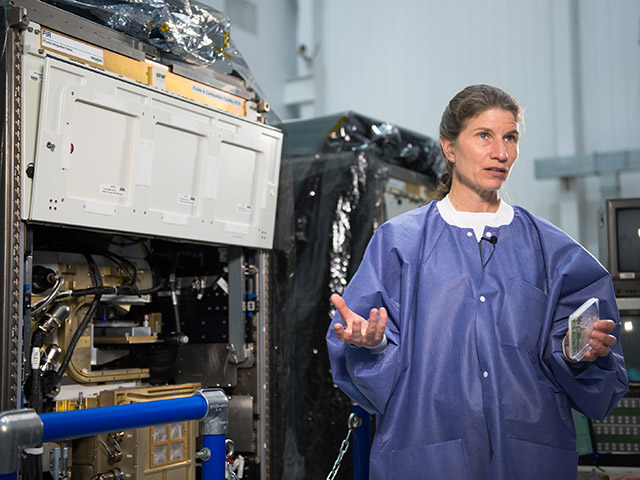 University of Florida professor interacting with the Fluids Integration Rack
