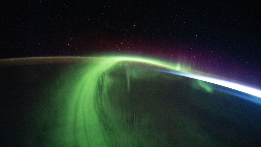 A vivid aurora streams over the Earth as the space station orbited 273 miles above the southern Indian Ocean in between Australia and Antarctica.