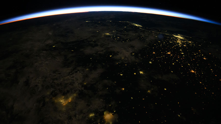 An orbital sunrise crowns Earth's horizon in this photograph from the International Space Station as it orbited 261 miles above Brazil.
