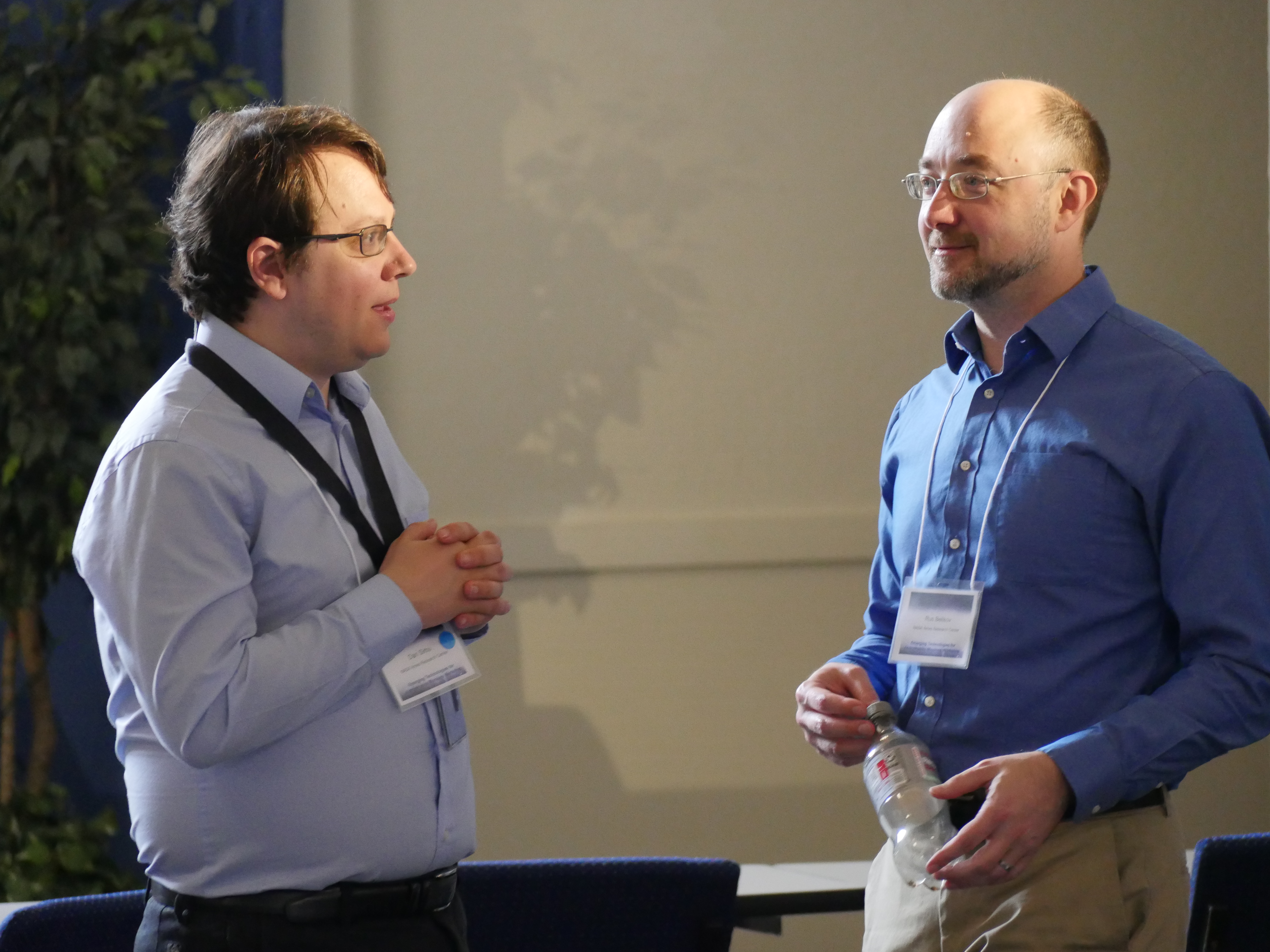 Dan Sirbu (left) and Rus Belekov (right) talk with one another. Photo taken at the 2025 workshop Emerging Technologies for Astrophysics Missions, h...