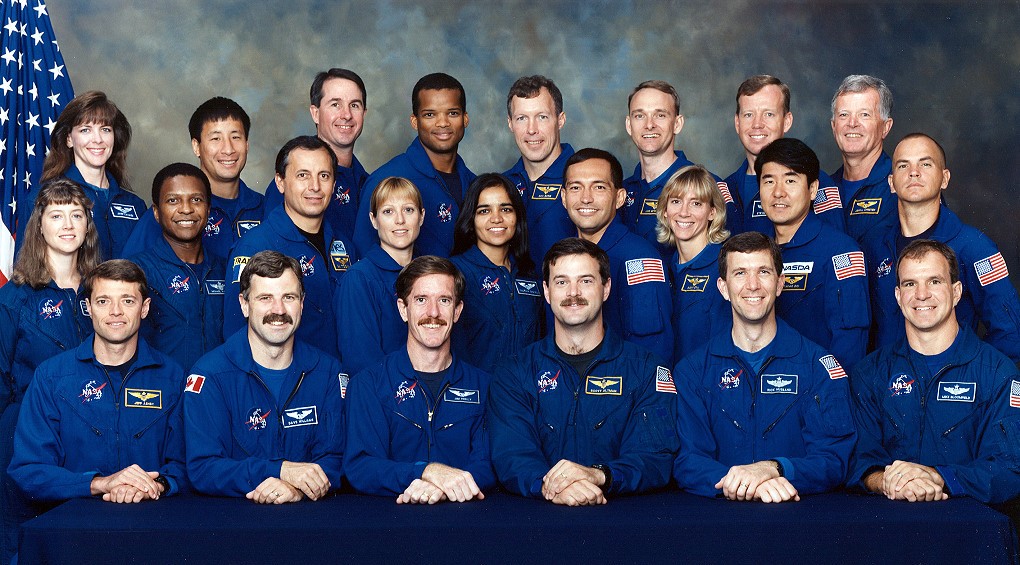 The Group 15 NASA and international astronaut candidates pose for a group photo – front row, Jeffrey S. Ashby, left, Dafydd “Dave” R. Williams, James F. Reilly, Scott D. Altman, Rick D. Husband, and Michael J. Bloomfield; middle row, Pamela A. Melroy, left, Michael P. Anderson, Michel Tognini, Kathryn “Kay” P. Hire, Kalpana Chawla, Carlos I. Noriega, Susan L. Still, Takao Doi, and Frederick “Rick” W. Sturckow; back row, Janet L. Kavandi, left, Edward T. Lu, Steven K. Robinson, Robert L. Curbeam, Dominic L.P. Gorie, Joe F. Edwards, Steven W. Lindsey, and Jean-Loup Chrétien.