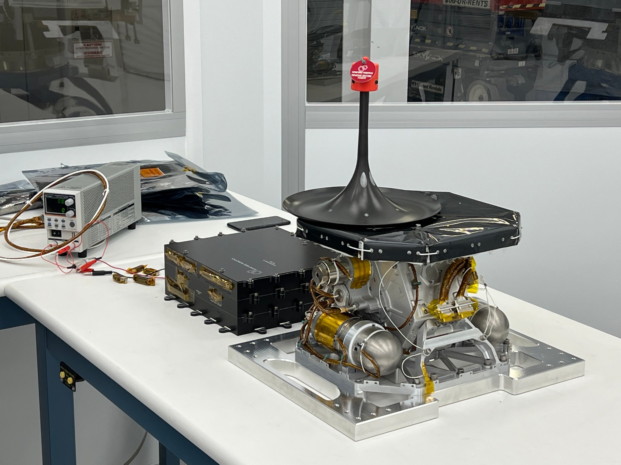 A science instrument flying aboard the next delivery for NASA’s CLPS (Commercial Lunar Payload Services) initiative could help improve our understanding of the Moon. The Lunar Instrumentation for Subsurface Thermal Exploration with Rapidity, or LISTER, is one of 10 payloads set to be carried to the Moon by the Blue Ghost 1 lunar lander in 2025. The instrument sits upon a white table.