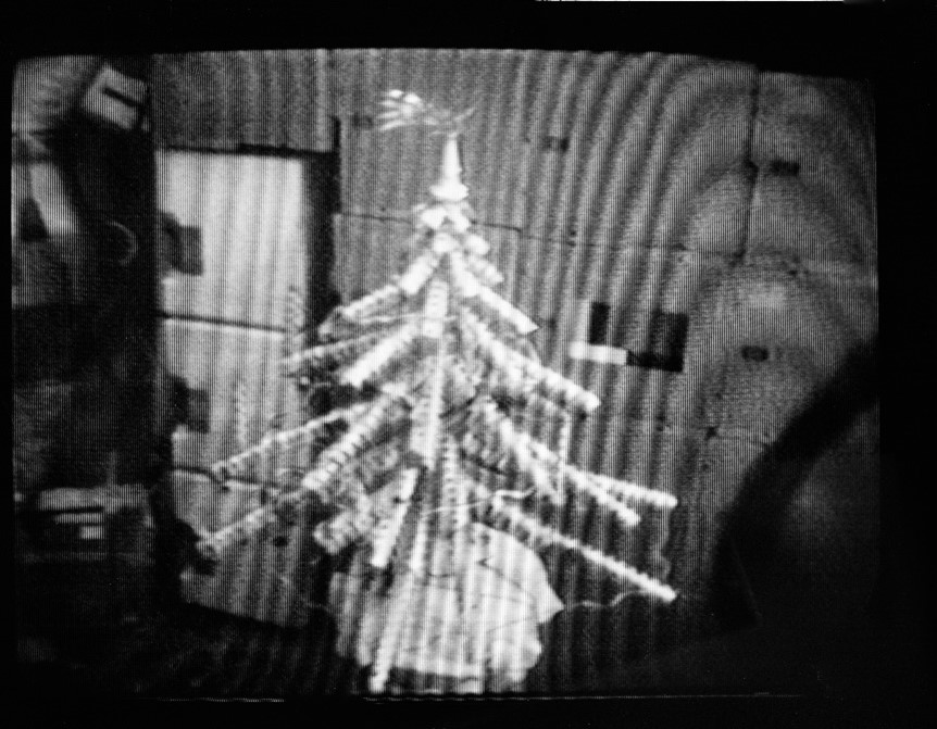 A black and white image of an aluminum Christmas tree
