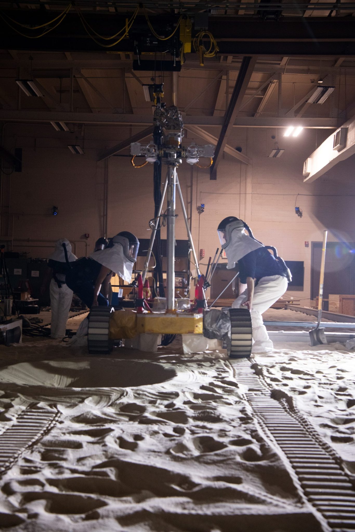 The VIPER Mobility Test Platform preparing to drive through a simulated crater