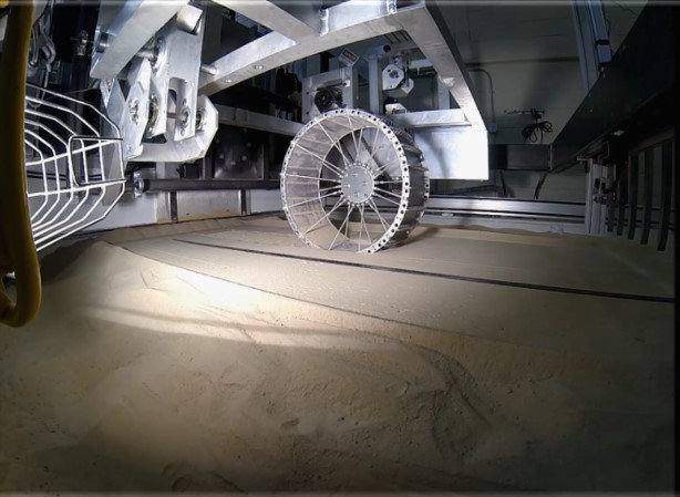 VIPER prototype wheel being tested on the TRaction and Excavation Capabilities rig in GRC-3 lunar simulant