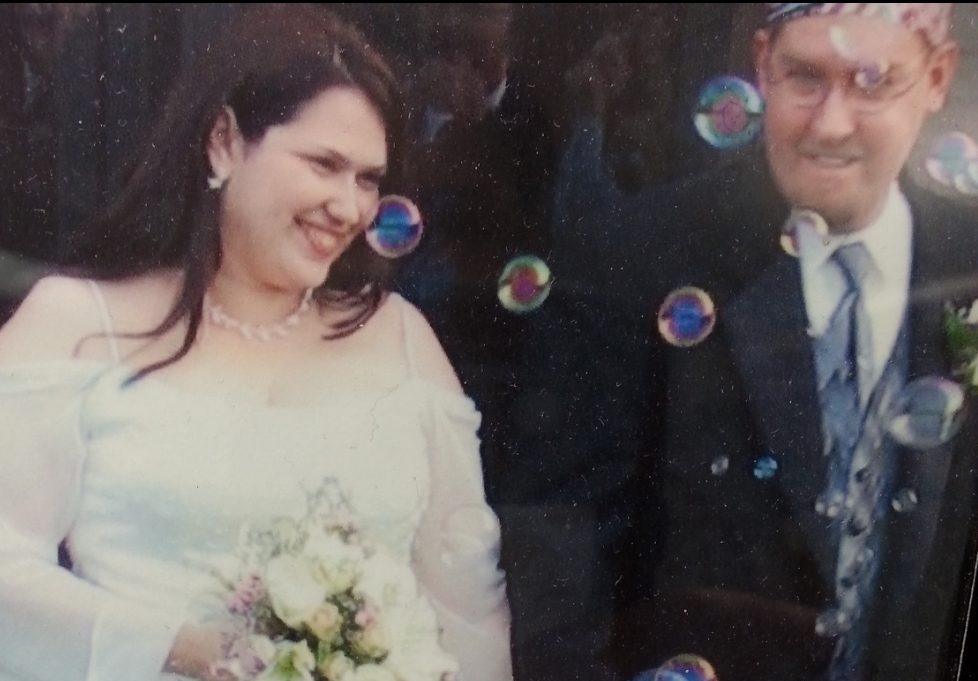 NASA employee Alicia Baker is pictured with her husband on their wedding day.