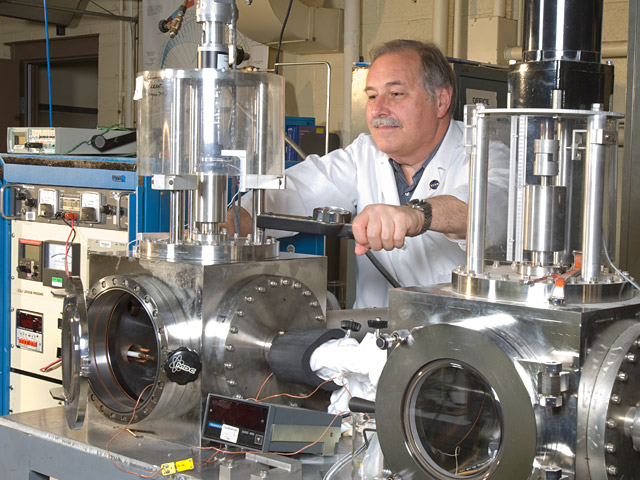 A technician checks the Bearing Tribometer Test for the Geostationary Operational Environmental Satellite (GOES)