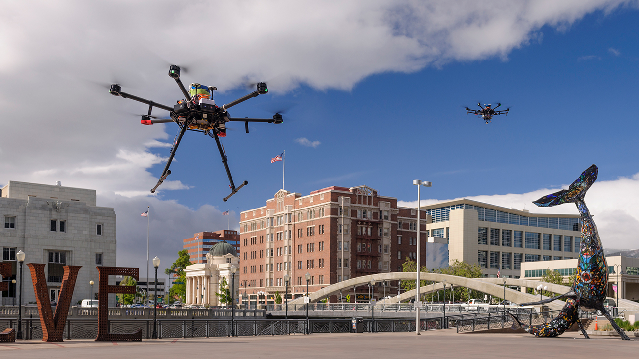 Two drones taking off during an Unmanned Aircraft System (UAS) Traffic Management (UTM) test flight conducted by the Human Systems Integration Division Airspace Operations Lab (AOL) in downtown renovation, Nevada