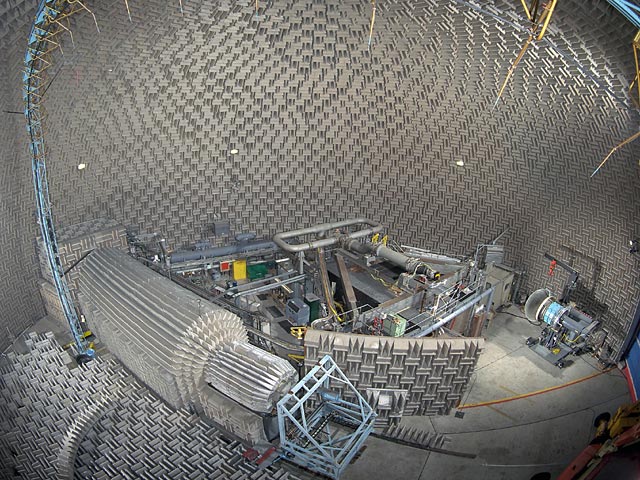 Wide-angle view of the interior of the Aero-Acoustic Propulsion Laboratory (AAPL) showing the Powered Lift Rig, Nozzle Acoustic Test Rig, and the Active Noise Control Fan (ANCF)