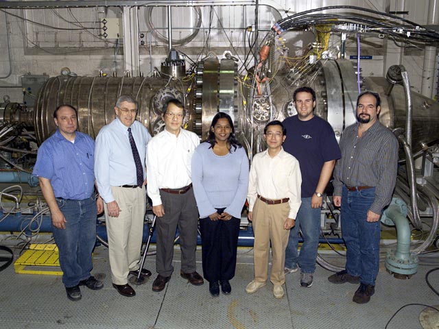 Researchers and technicians pose in front of the Advanced Subsonic Combustion Rig
