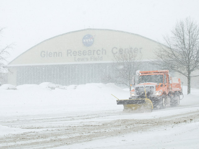 Snowplowing on Taylor Road in front of the Flight Research Building