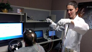 NASA researcher Dr. Erin Flynn-Evans, lead of NASA's Fatigue Countermeasures Group, prepares a research subject for a fatigue study