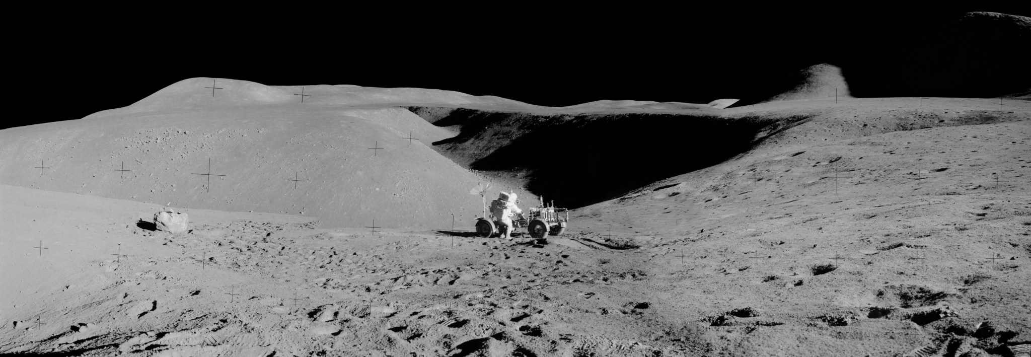 Panorama of the lunar surface with the Apollo 15 lunar rover and astronaut David R. Scott