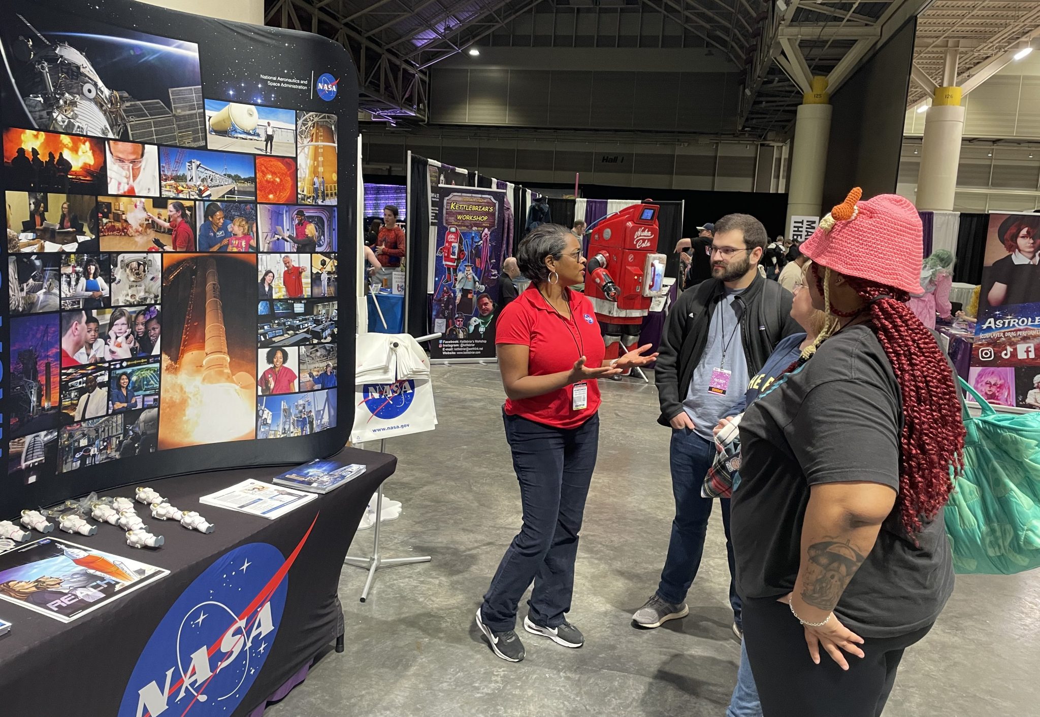Stennis representative Dawn Davis, left, interacts with people at 2025 FAN EXPO