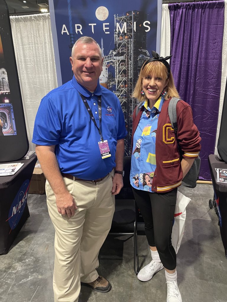 Stennis representative Troy Frisbie, left, is pictured with Colleen Cooper, daughter of L Gordon Cooper Jr., one of the original Mercury Seven astronauts, during the 2025 FAN EXPO