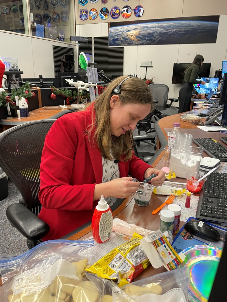 Fiona Antkowiak prepares icing for the cookies at her desk in the MCC