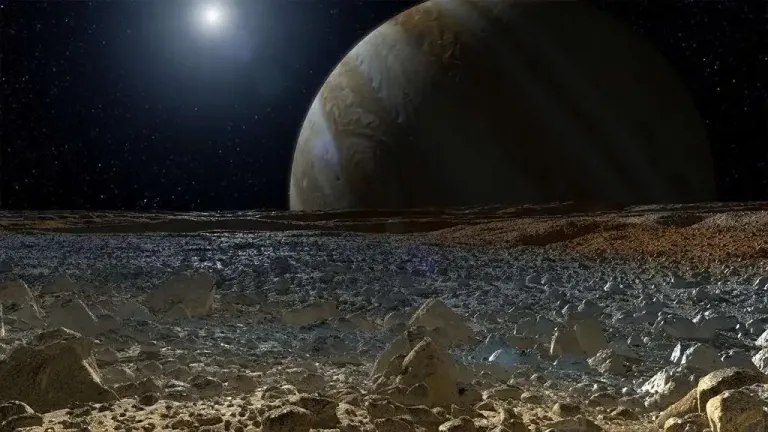 This illustration shows a simulated view from the icy surface of Jupiter's moon Europa, with the giant planet behind it.