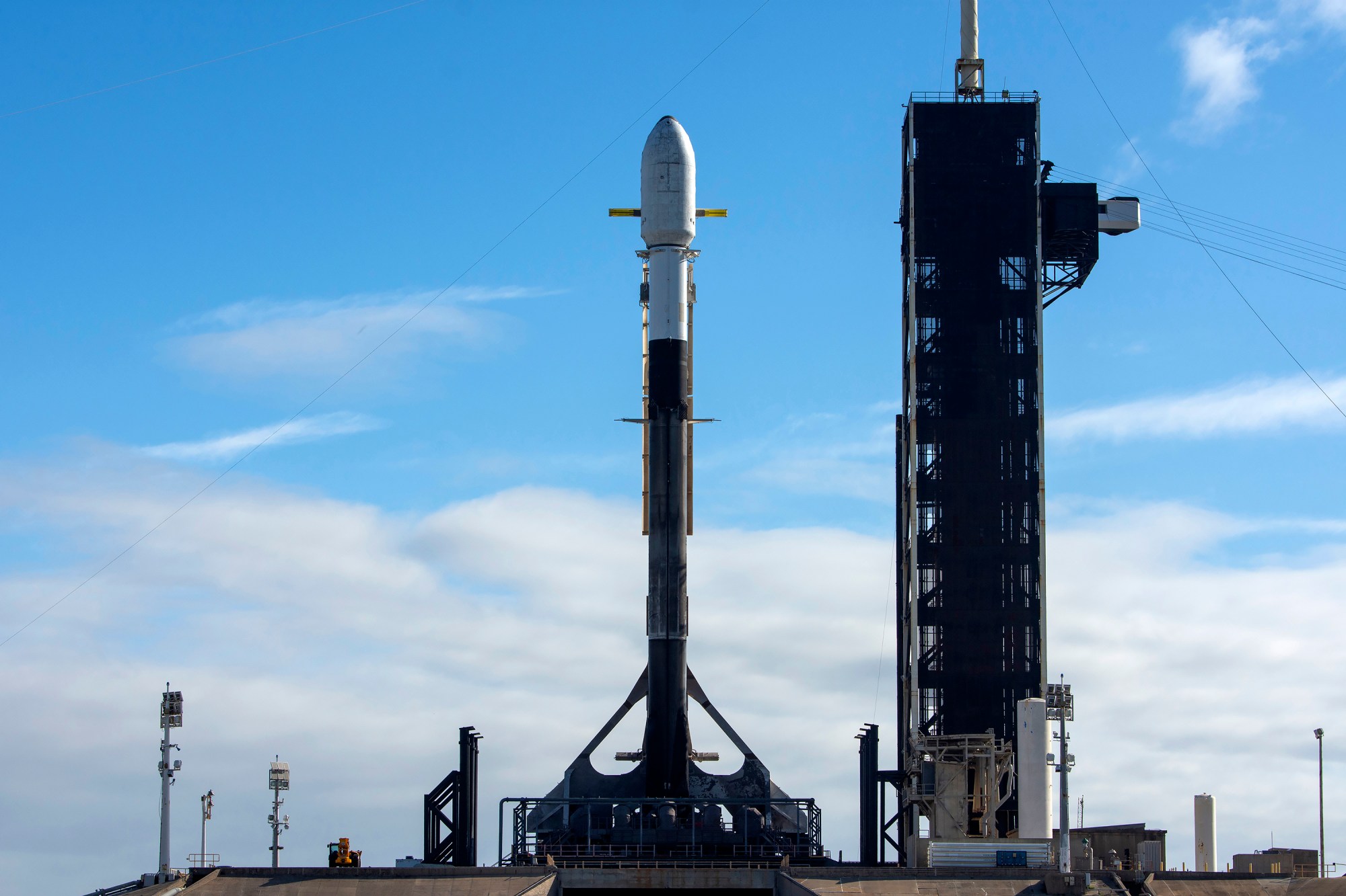 A SpaceX Falcon 9 rocket carrying Intuitive Machines’ Athena lunar lander stands vertical at Launch Pad 39A at NASA’s Kennedy Space Center in Florida.