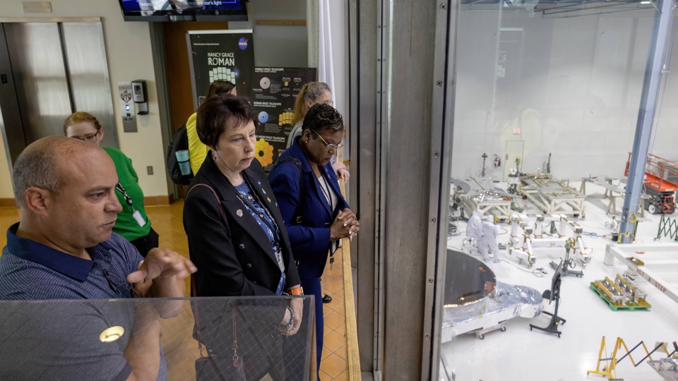 Jamie Dunn and coworkers looking into a clean room
