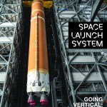 Cover of the SLS (Space Launch System) October-December 2024 Highlights. Shows the Artemis II rocket hanging in Kennedy Space Center's VAB (Vehicle Assembly Building).