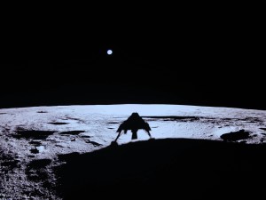 Earth is a small pale circle in the sky in this image taken on the Moon by a camera on @Firefly’s Blue Ghost lunar lander. The Moon’s gray surface sharply contrasts with the blackness of space. The lander’s shadow can be seen on the ground.
