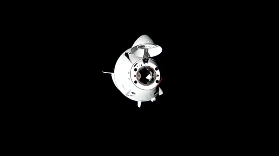 The SpaceX Dragon crew spacecraft carrying the four Crew-10 members approaches the International Space Station.