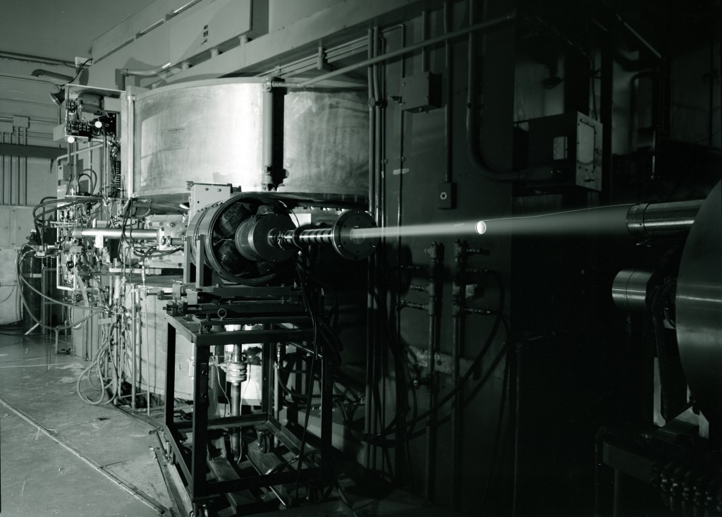 Cyclotron emitting laser beam